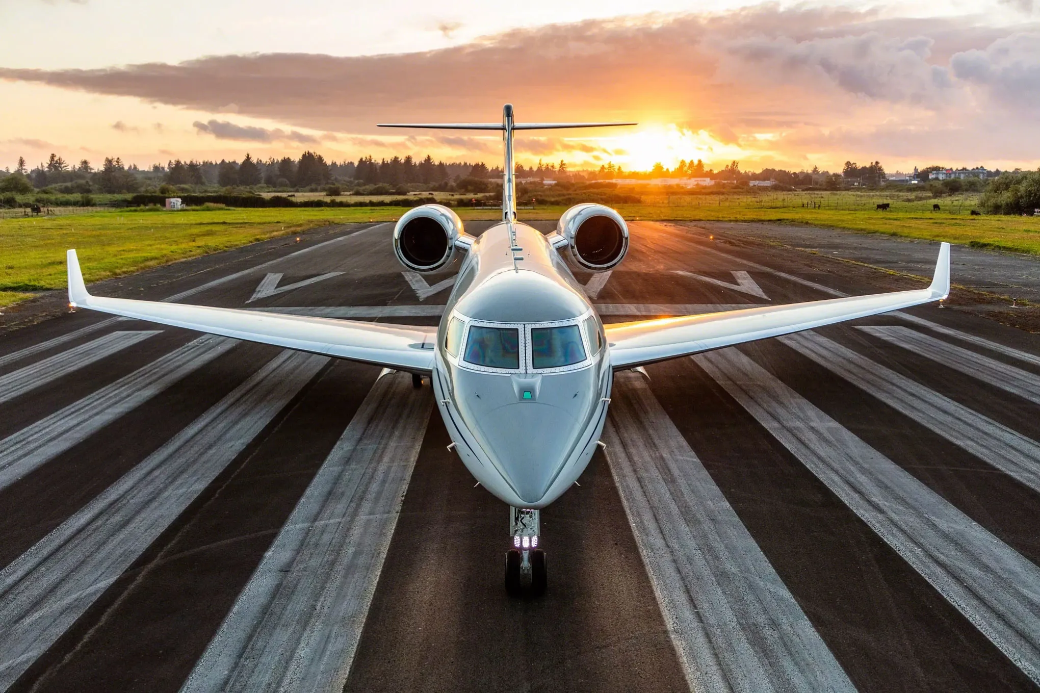 Gulfstream G500 on the runway at sunset, head-on