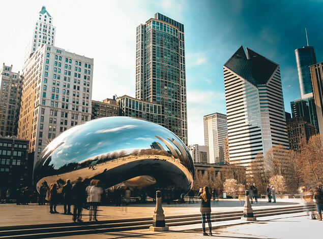 Chicago: Cloud Gate, the mirrored bean sculpture in Millennium Park, reflecting the surrounding towers and visitors