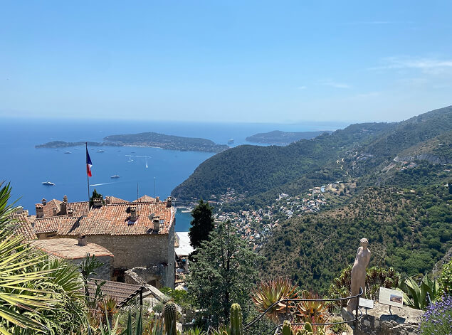 Nice: A terracotta rooftop above the Côte d’Azur, a French flag flying over the headland and anchored yachts below