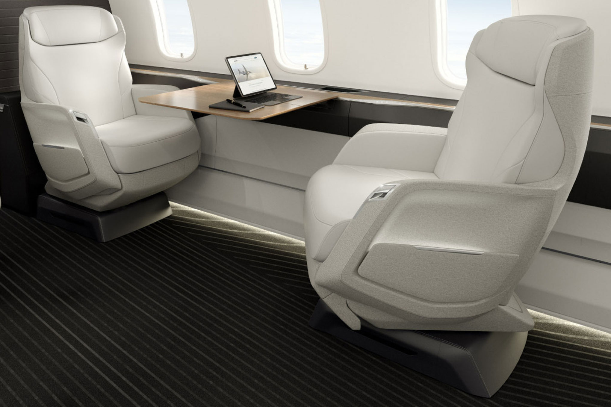 Bombardier Challenger 350/3500 cabin with white leather seats and a work table