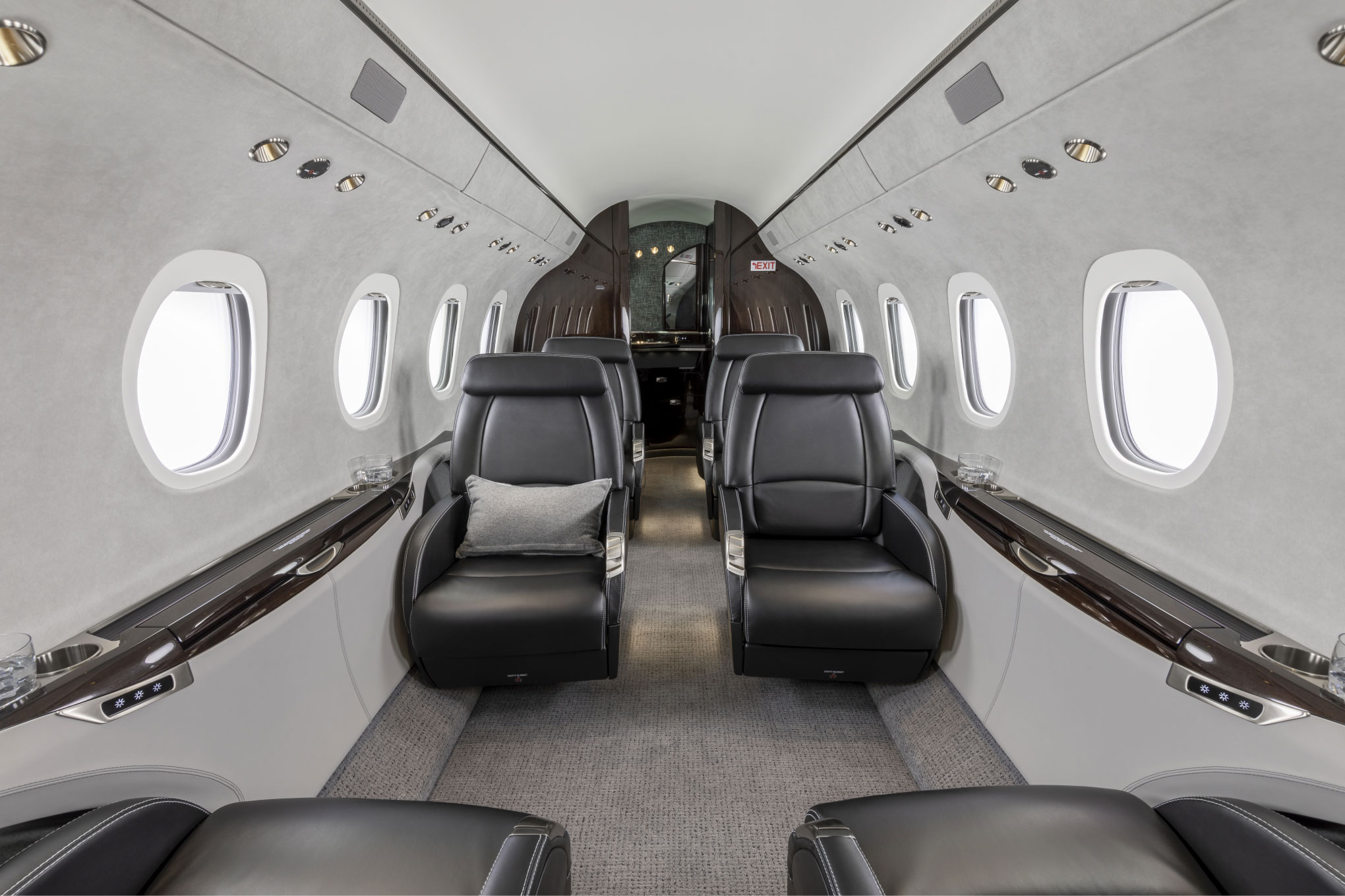 Cessna Citation Latitude cabin aisle with black leather club seats