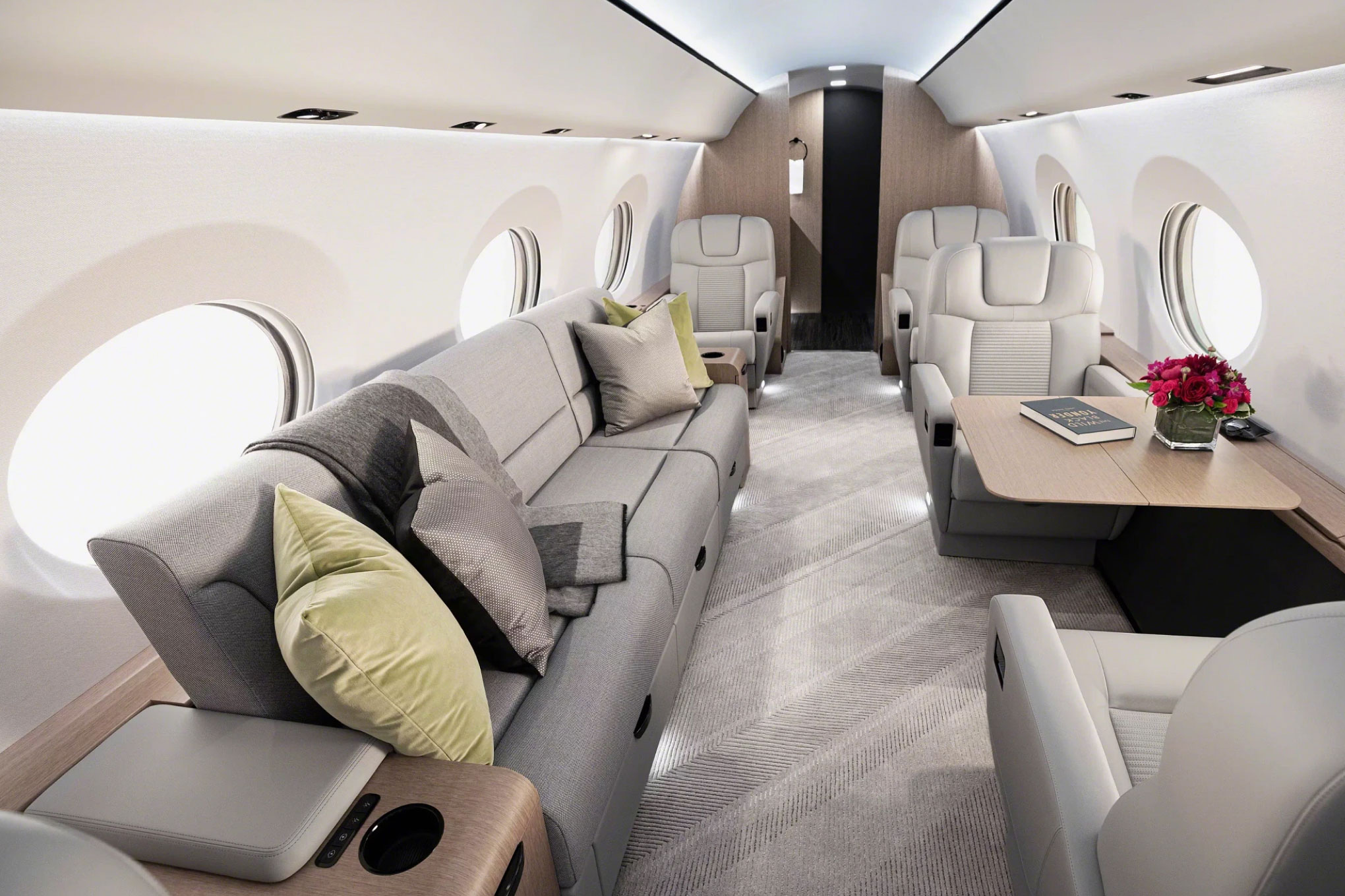 Gulfstream G400 cabin with a divan and club seats around a table