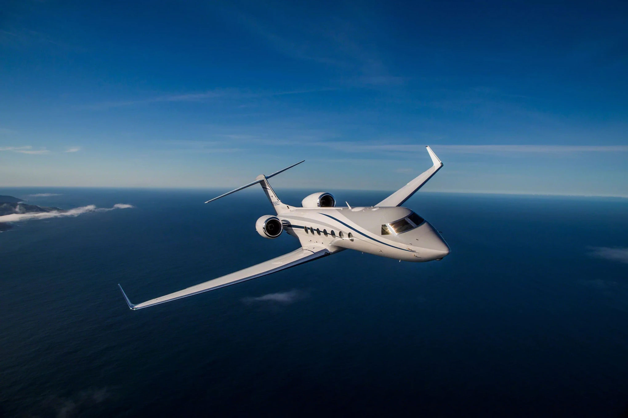 Gulfstream G550 in flight over the open ocean