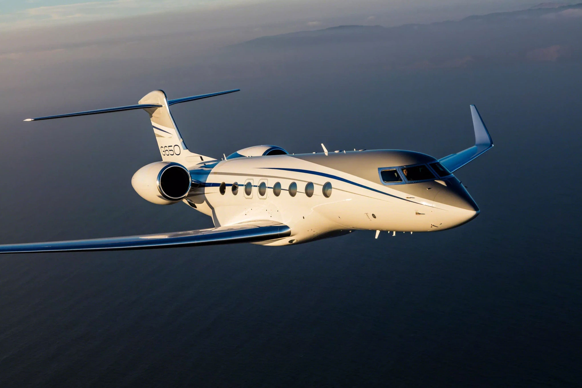 Gulfstream G650 in flight over the ocean