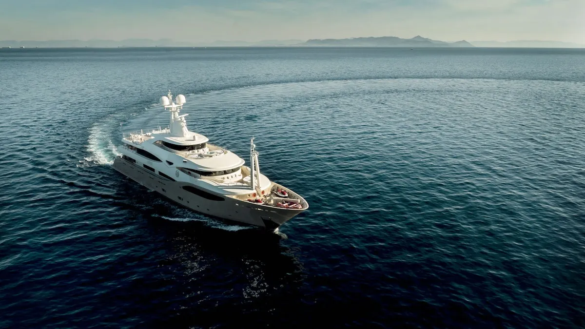 Superyacht under way on open blue water